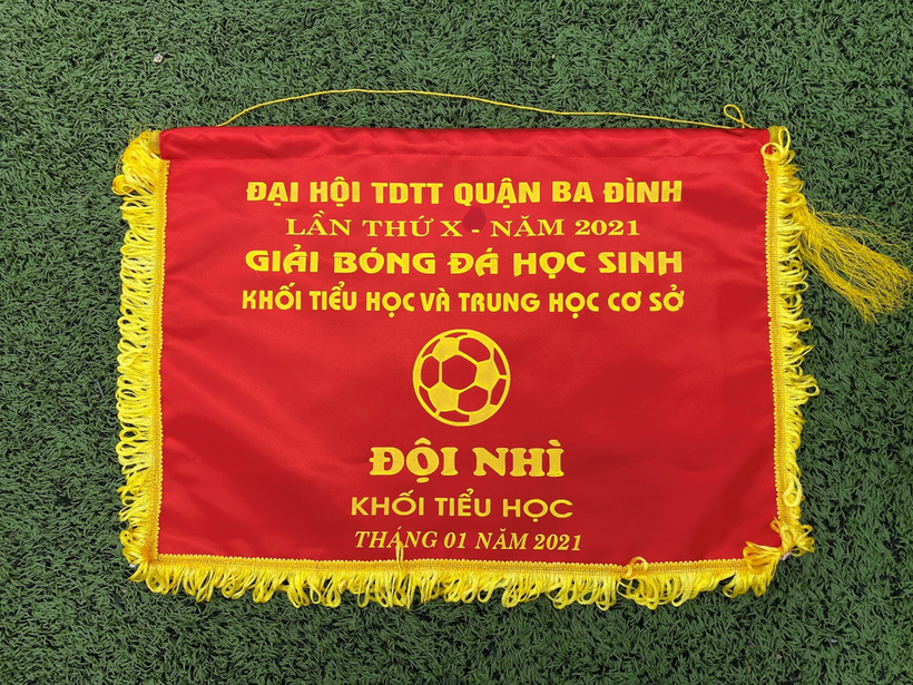 A red and yellow flag with yellow fringe

Description automatically generated