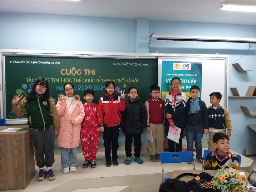 A group of children standing in a classroomDescription automatically generated